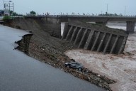 Flash floods leave 34 dead in Indian-controlled Kashmir as over 210,000 in Pakistan are displaced