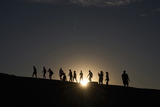 Searing heat draws visitors to California's Death Valley, where it's tough to communicate the risks