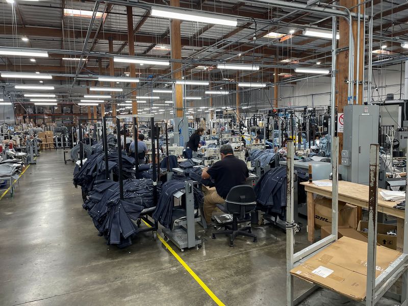 US business activity picks up in August, factories lead the way