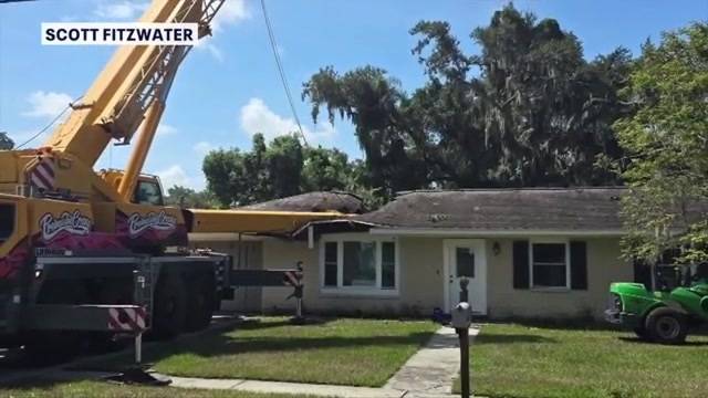 ‘It ended up 2 feet above our heads’: 80-ton crane’s boom snaps, crashes on top of home near Tampa 