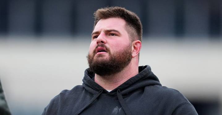 Landon Dickerson walking around after Eagles practice one day after knee procedure