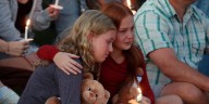 Hundreds honor 2 children killed and 17 people wounded in shooting at a Minneapolis Catholic school