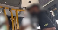 Wild moment fuming bus passenger attacks driver and attempts to take over the wheel