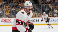 Red Wings sign D Travis Hamonic to one