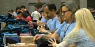 Hundreds of Charlotte-area volunteers stuff backpacks for underprivileged students