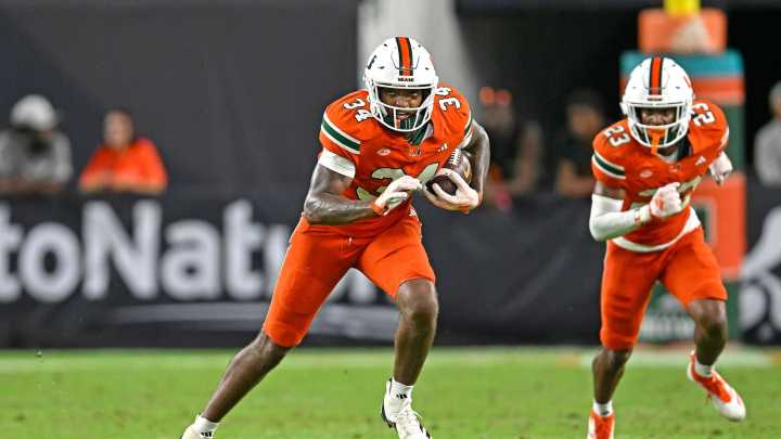 College football star charged with vehicular homicide over crash which killed three including two children
