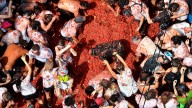Spain’s ‘Tomatina’ food fight turns tomatoes into projectiles