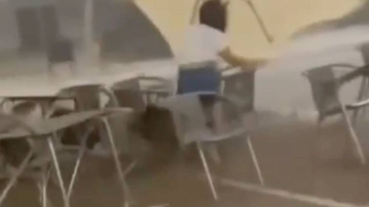 Horror moment TORNADO hits Spanish resort sending furniture at tourist cafe flying during rare ‘Satan’s Storm’