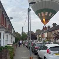 Hot air balloon makes emergency crash landing in busy street