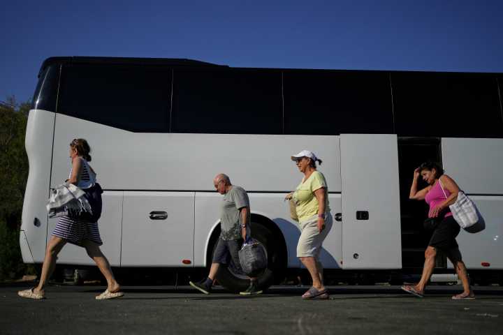 Beach on a budget: Greeks settle for day trips, priced out of iconic destinations