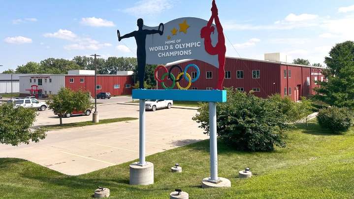 Years after abuse reports, ex-coach at renowned US gymnastics academy is arrested by FBI