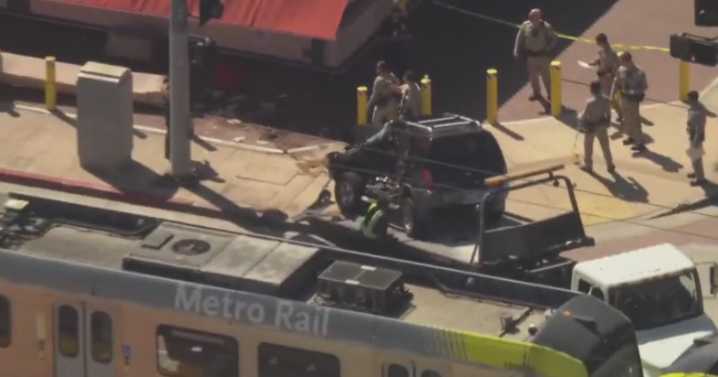 Driver collides with train, slams into sign outside King Taco in East Los Angeles