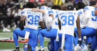 Detroit Lions safety Morice Norris taken off field in ambulance after hit; teams agree to suspend game