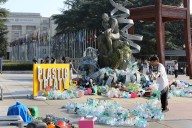 Artist drowns sculpture outside UN office in waste during plastic pollution treaty talks