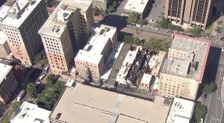 Firefighters survey Main Street fire from the air