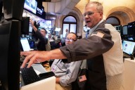 Wall Street rallies and the Dow soars 800 points on hopes for lower interest rates