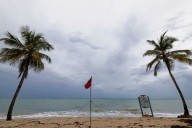 Hurricane Erin grows but weakens to Category 3, expected to miss U.S.