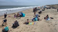 Beachgoers enjoy Cape Henlopen State Park on Aug. 20.