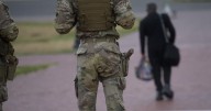 Pentagon says some Guard units in Washington are now carrying firearms as Trump targets more cities