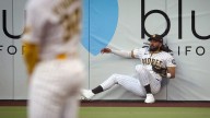 Tatis makes spectacular leaping catch to rob Devers of a home run