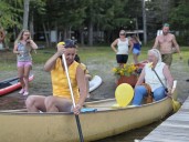 Scores gather at Maine pond to honor slain paddleboarder