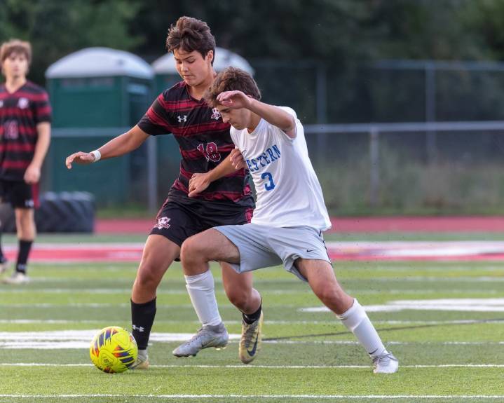 Photo gallery of Walled Lake Western at Milford in LVC boys soccer action