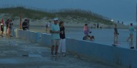 Locals and tourists enjoy winds and waves at Atlantic Beach from Hurricane Erin
