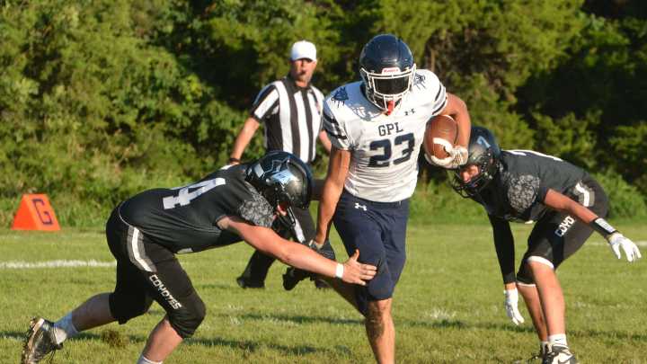 Great Plains Lutheran's Lucas Johnson finds the end zone in season opener