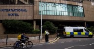 Woman charged with assault tried to force her way into migrant hotel, court told
