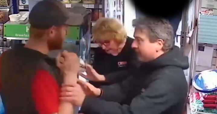 Moment thug threatened Bristol shop staff with broken wine bottle