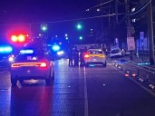 Police officer injured in wreck; one detained