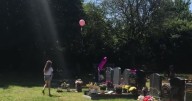 Mum's captures chilling moment 'baby's spirit returns to put a balloon on her grave'