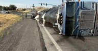 Semi-truck overturns on I