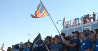 Community dresses blue for first football game since officers killed