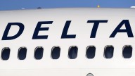Delta plane wing clips empty aircraft during pushback from gate in Atlanta