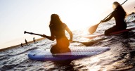 Woman left in floods of tears as she spots unusual sight in water while paddleboarding
