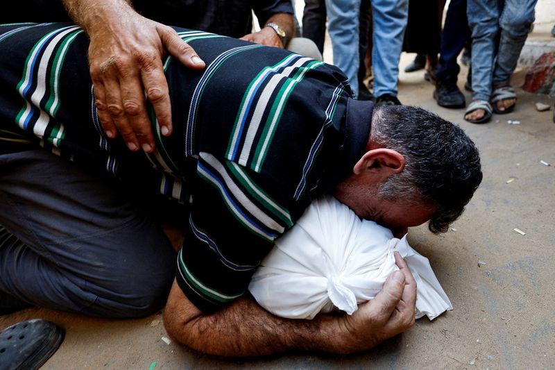Israel pounds Gaza City suburbs, vows to press on with offensive