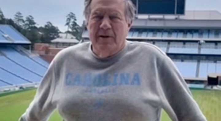 PHOTOS: Everyone Was Making The Same Cruel Joke After Noticing Something Very Odd About Bill Belichick’s Appearance As He Posed In Sweater & Shorts At UNC