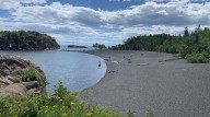 U.S. Coast Guard Uses Helicopter To Rescue Children Near Black Beach
