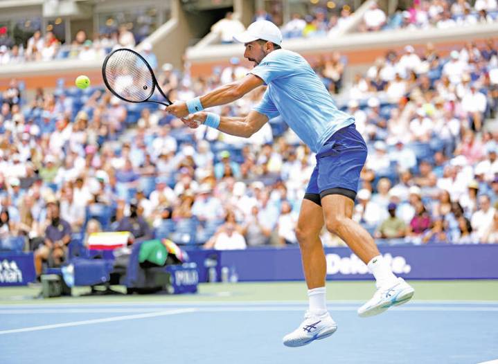 Djokovic battles, Raducanu romps through US Open second round