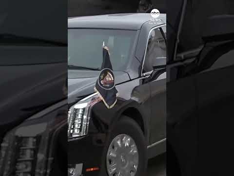 Putin waves to reporters as he shares a ride with Trump