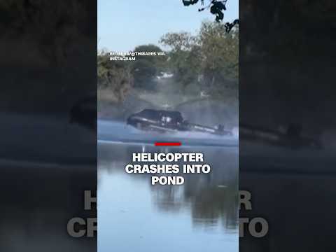 Helicopter crashes into pond