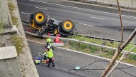 Man seriously injured after tractor falls off bridge on to M20
