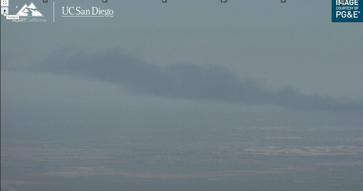 Large fire south of Stockton sends column of smoke into sky