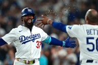 Betts' sacrifice fly and Hernández's homer lift Dodgers over Padres for tie in NL West