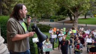 UO faculty and supporters rally in opposition to…