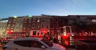 Firefighters battle two-alarm building fire in downtown Baltimore