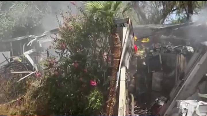 Woman escapes Phoenix mobile home fire that killed her husband and 2 dogs