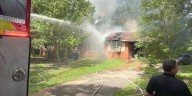 Man hospitalized after house fire on Gentry Lane