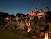 Grief and fury as thousands gather at vigils for Annunciation Church victims